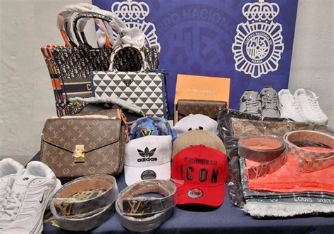 malaga fake clothes|Twenty arrested and almost 3,000 fake goods seized  .